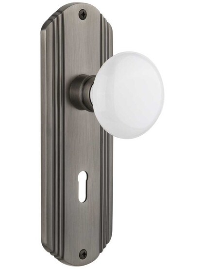 Streamline Moderne Mortise Lock Set With White Porcelain Door Knobs in Antique Pewter.